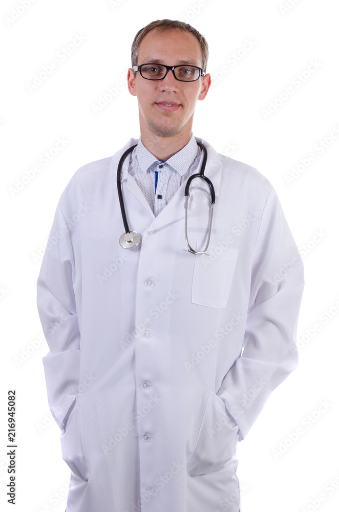 Adult doctor standing in white lab coat with hands in pocket with glasses and stethoscope and smiling on white background Adult doctor standing in white lab coat with hands in pocket with glasses and stethoscope and smiling on white background