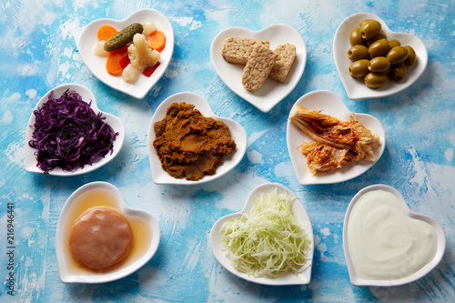 An assortment of fermented foods in dishes