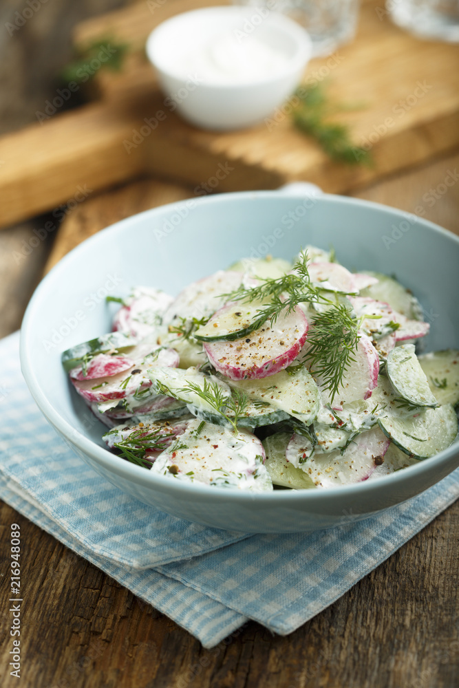 Radish and cucumber salad with sour cream or yogurt dressing Radish and cucumber salad with sour cream or yogurt dressing