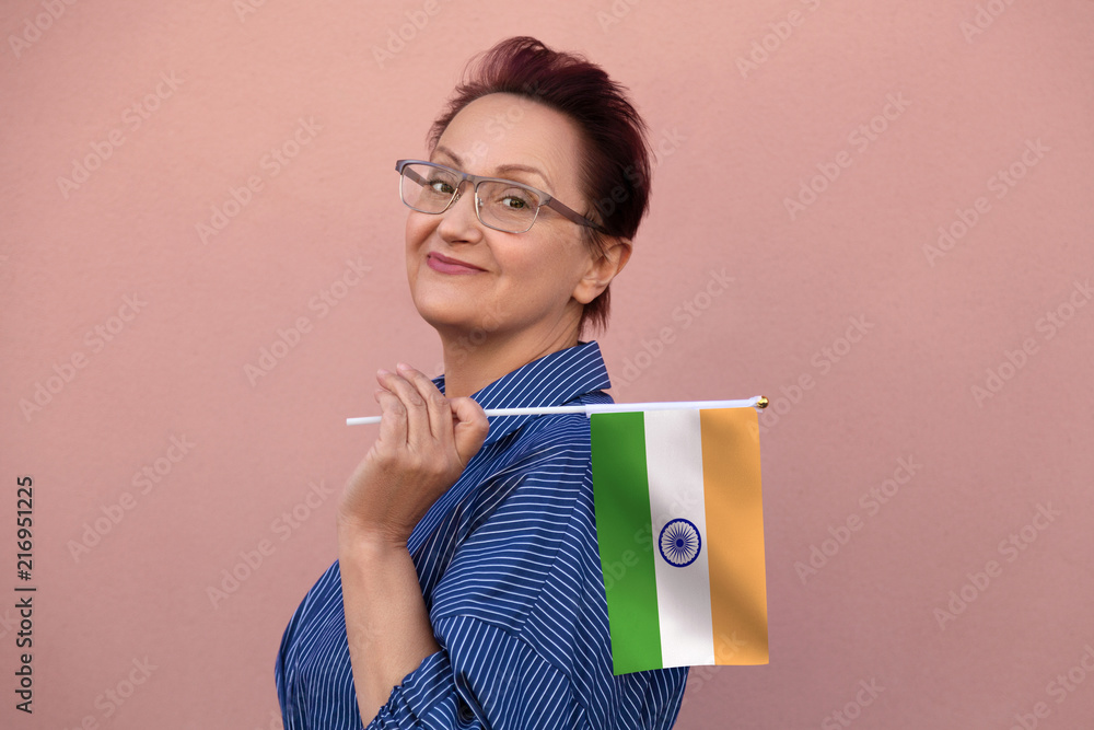 India flag. Woman holding Indian flag. Nice portrait of middle aged