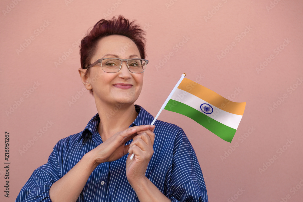 India flag. Woman holding Indian flag. Nice portrait of middle aged