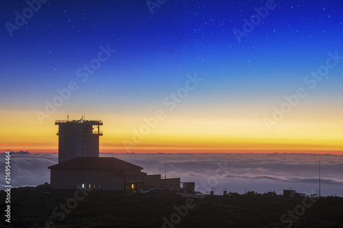 astronomical observatory against the background of a volcano at sunrise © Mike Mareen