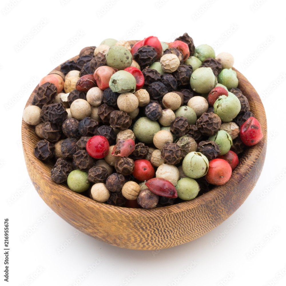 Pepper mix seed on spoon on white background. Pepper mix seed on spoon on white background.