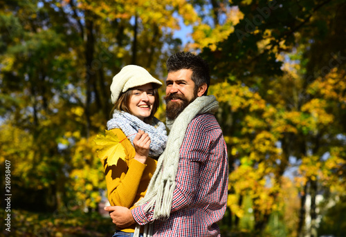 Young family and autumn concept. Girl and bearded guy