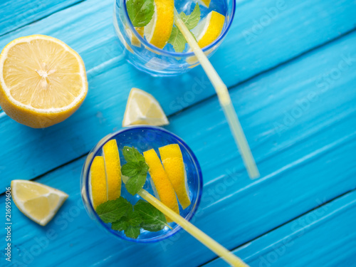 Refreshing lemonade in glass glasses on the table