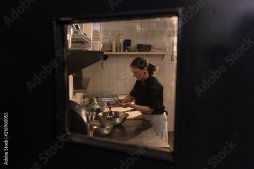 Chef working in the commercial kitchen photo