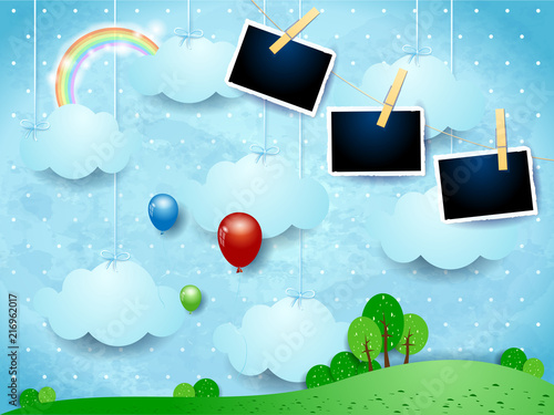 Surreal landscape with hanging clouds, balloons and photo frames