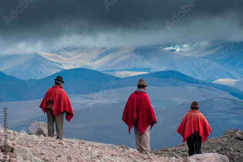 5000 m - 3 red poncho on Chimborazo volcano photo