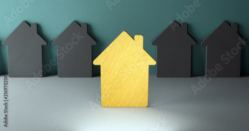 Immobilie auswählen beim Hauskauf. Goldenes Haus im Vordergrund als Favorit. Graue Häuser im Hintergrund. photo