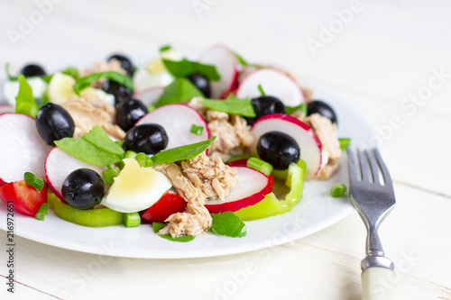 Nicoise salad with tuna, egg, cherry tomatoes and black olives. French cuisine