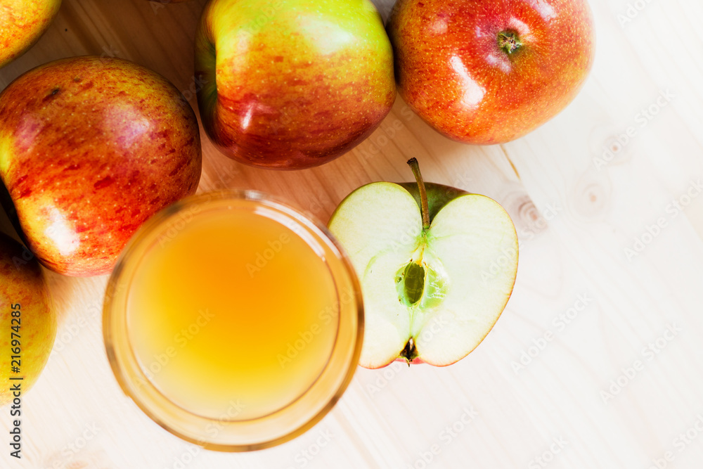 Glass of fresh apple cider near autumn apples Glass of fresh apple cider near autumn apples