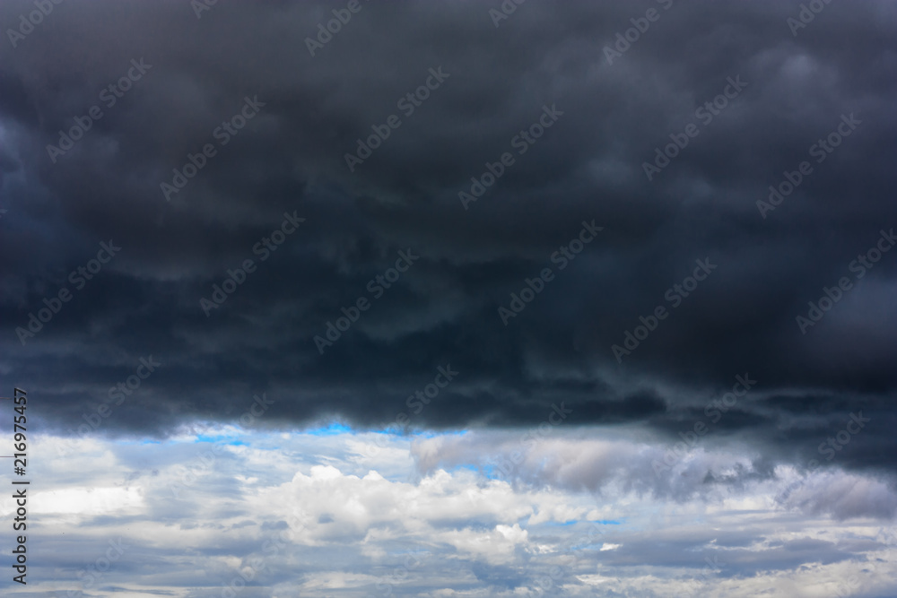Stormy clouds moving in the blue sky background for rainy season and nature concept
