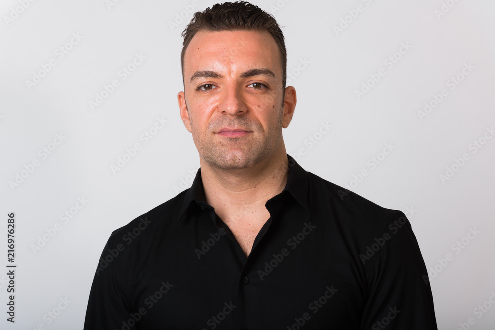 Portrait Of Handsome Businessman Against White Background Portrait Of Handsome Businessman Against White Background