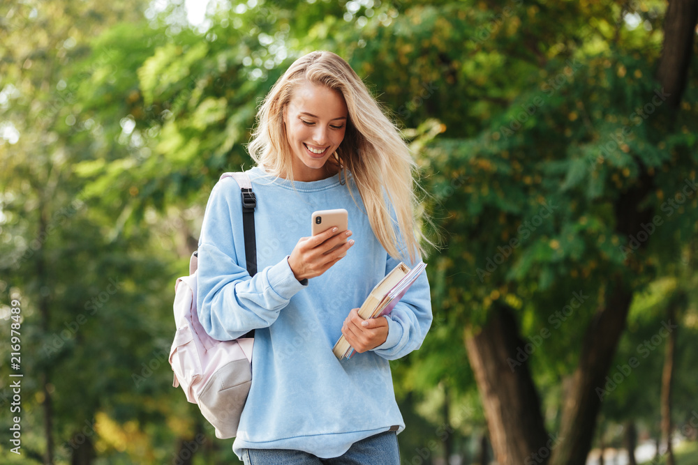 Portrait of a smiling young girl student with backpack Portrait of a smiling young girl student with backpack