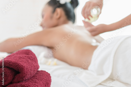 woman lying down on a massage bed at a spa