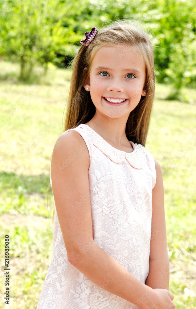 Portrait of adorable smiling little girl outdoors Portrait of adorable smiling little girl outdoors