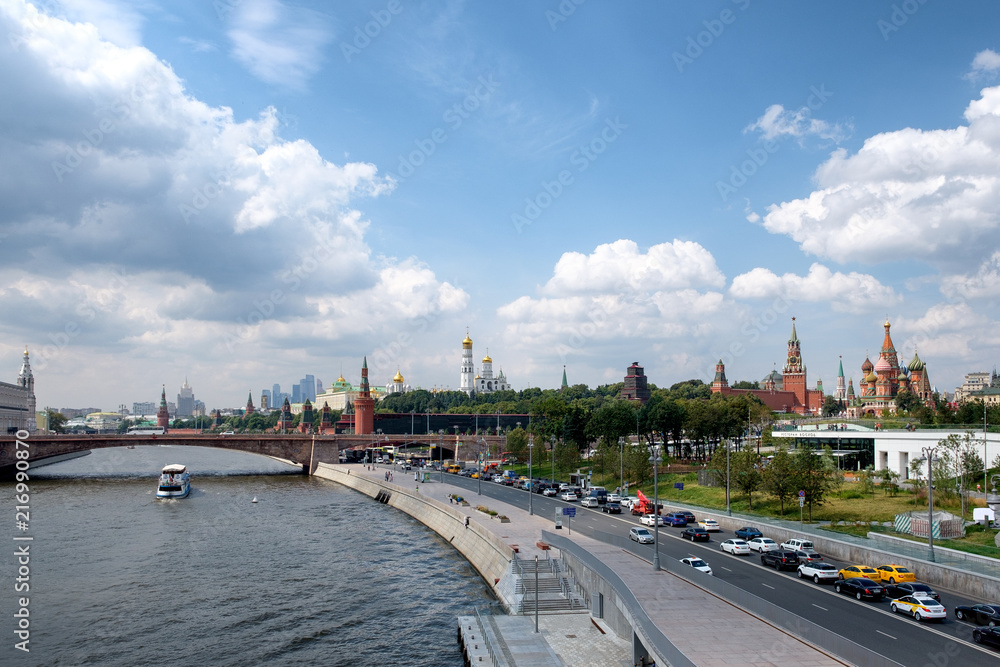 A view of the Moscow Kremlin, the river and the embankment from the floating bridge of the Zaryadie Park. Moscow, Russia