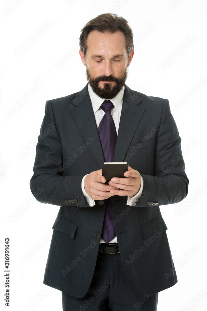 Sending important message. Businessman formal suit holds smartphone. Man bearded businessman concentrated on texting with colleague. Checking email or sending message. Smartphone gives opportunities Sending important message. Businessman formal suit holds smartphone. Man bearded businessman concentrated on texting with colleague. Checking email or sending message. Smartphone gives opportunities
