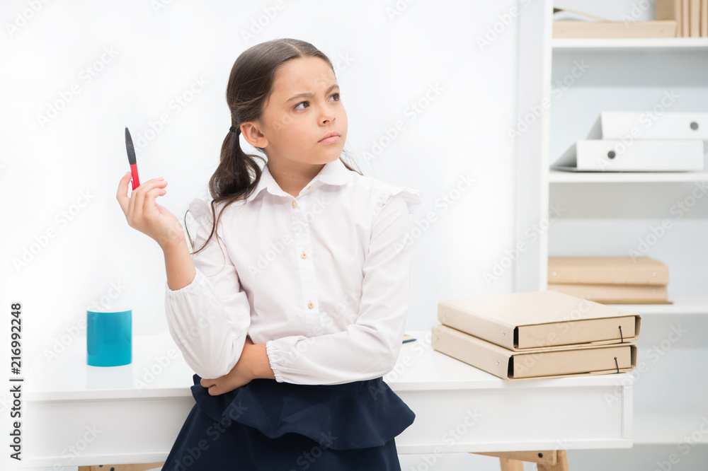 Let me think. Child girl wears school uniform standing with remembering face expression. Schoolgirl smart child looks thoughtful white interior background. Girl try to remember her knowledge Let me think. Child girl wears school uniform standing with remembering face expression. Schoolgirl smart child looks thoughtful white interior background. Girl try to remember her knowledge