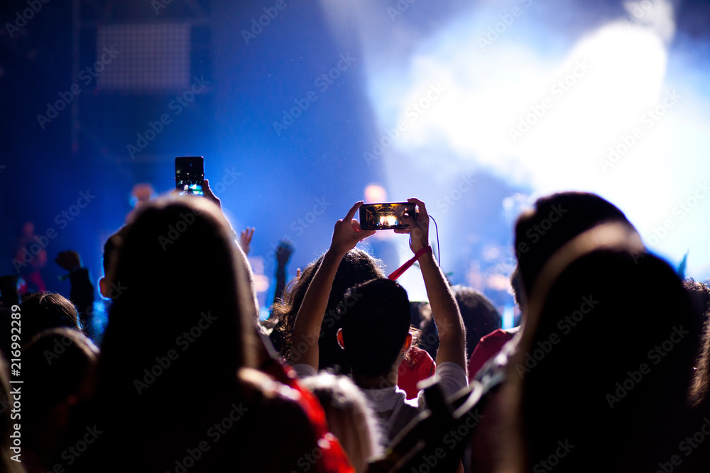 cheering crowd with raised hands at concert - music festival cheering crowd with raised hands at concert - music festival