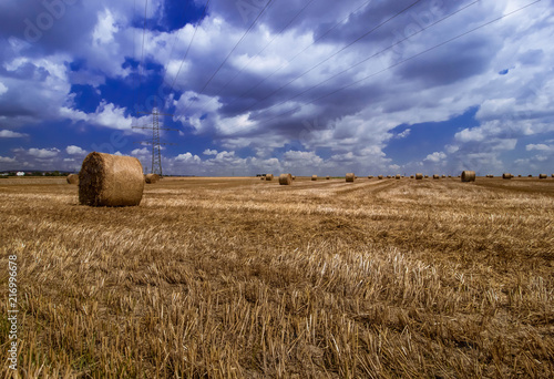 of hay bales and clouds 