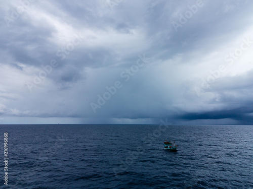 Dark & Dramatic blue sky and dark & Dramatic blue sea color and dark storm raining cloud background.