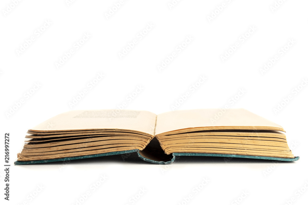 An open old book on a white background with copy space An open old book on a white background with copy space