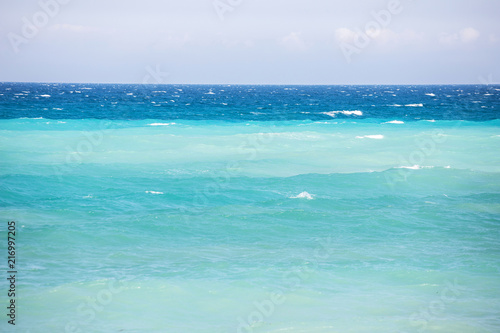 Clean clear turquoise blue waters in the beautiful ocean