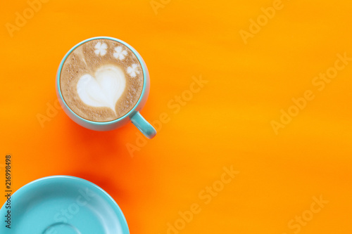Hot Coffee Latte Art Heart on color background.