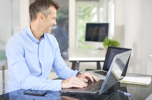 Financial advisor businessman using laptops in the office