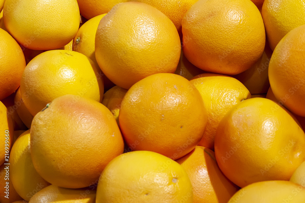 Fresh Mandarins spread out evenly in the shop window. Fresh Mandarins spread out evenly in the shop window.