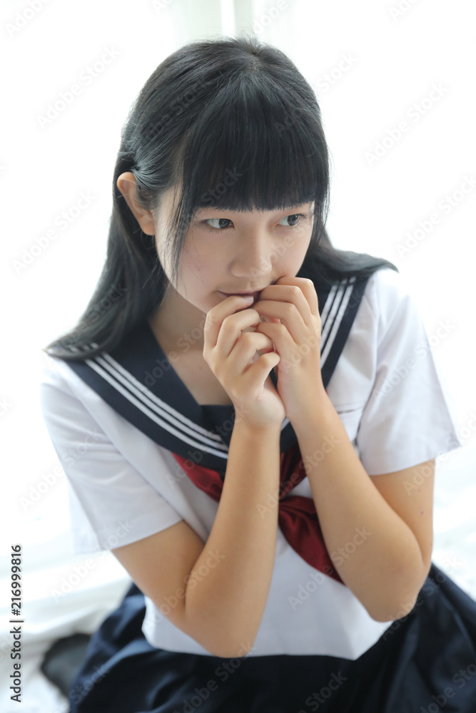 Portrait japanese school girl in white tone bed room Portrait japanese school girl in white tone bed room