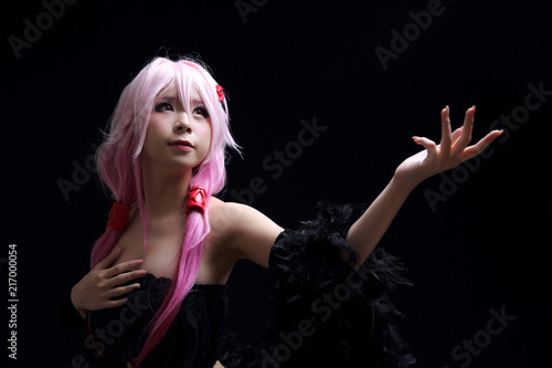 Portrait of Japan anime cosplay girl isolated in black background