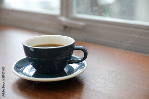 Black coffee in Coffee cup on wood background