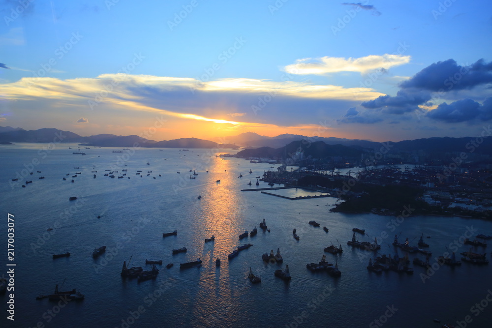 Fototapeta premium dawn of the busy harbor in hong kong, china