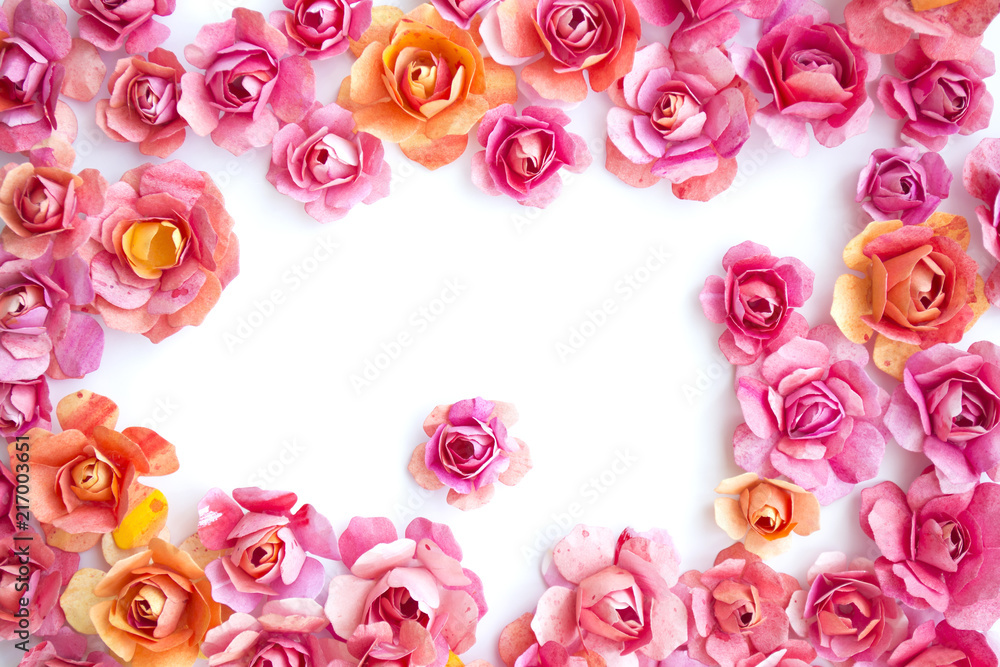 frame of colorful paper pink flowers, roses on white background