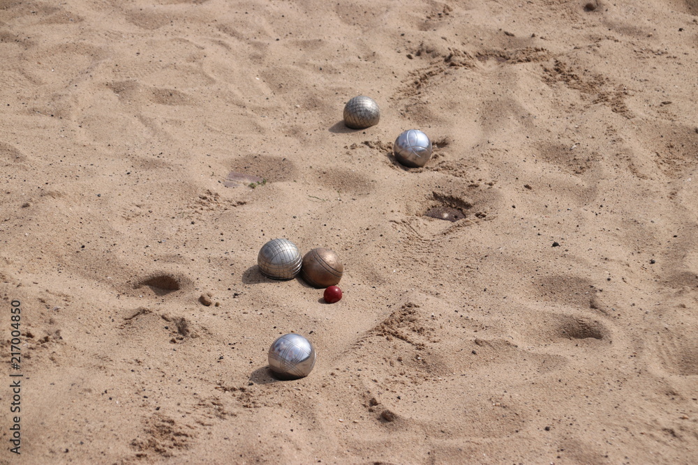Jeu de boules game on a floor of sand on the town hall square in Nieuwerkerk aan den IJssel in the Netherlands Jeu de boules game on a floor of sand on the town hall square in Nieuwerkerk aan den IJssel in the Netherlands