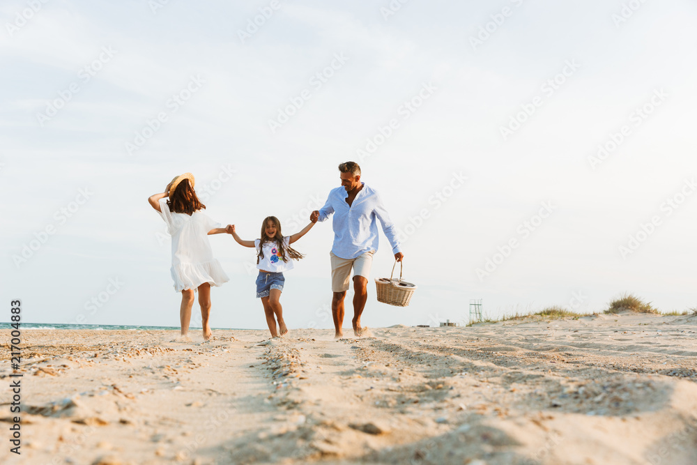 Happy family having fun together at the beach.