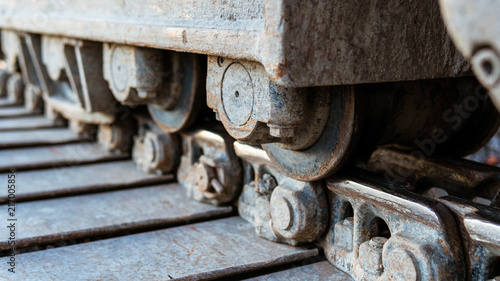 Continuous tracks on a backhoe loader.