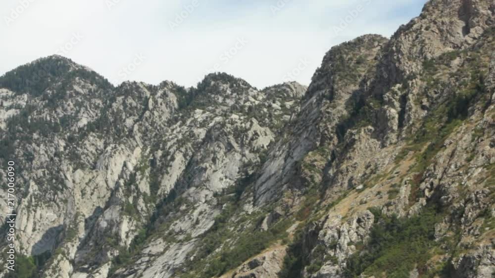 Smooth moving shot of white and green mountains in Utah Smooth moving shot of white and green mountains in Utah