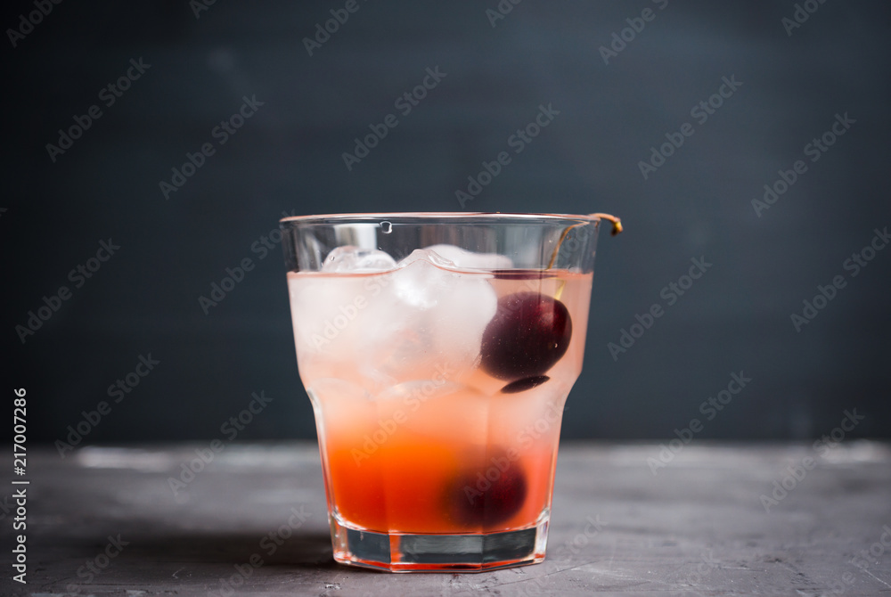 Old fashioned cocktail with cherry. Selective focus. Old fashioned cocktail with cherry. Selective focus.