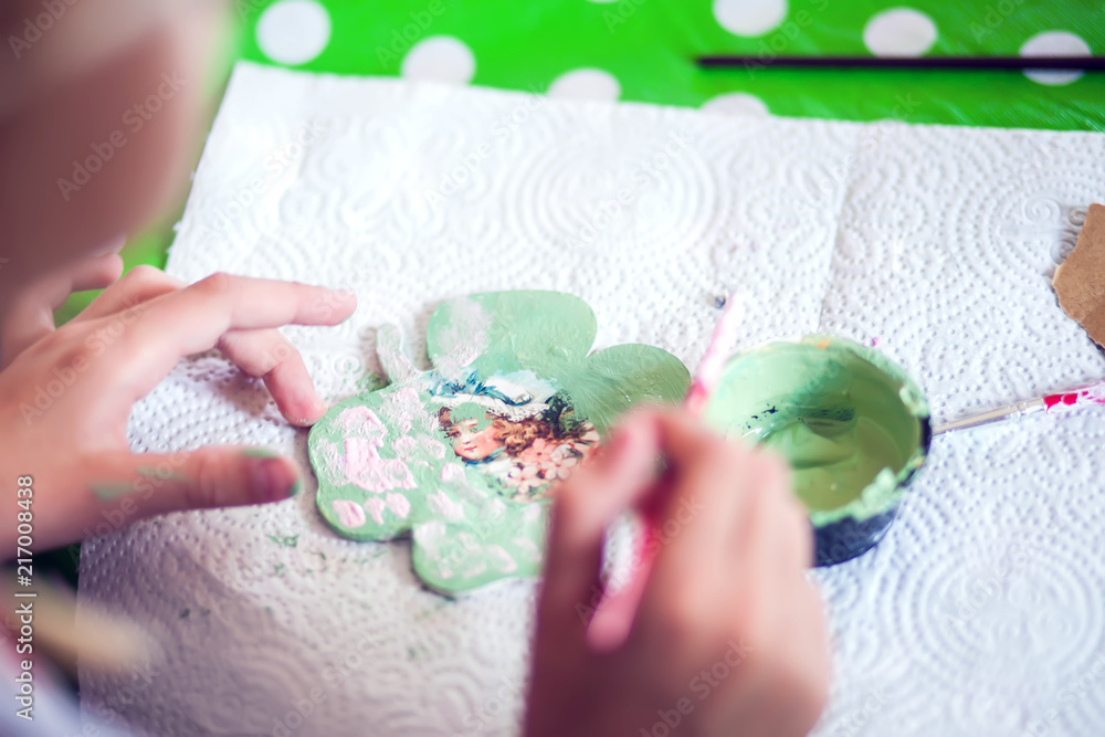 Children hands making artworks with wood and paint crafts. workplace and handcraft Children hands making artworks with wood and paint crafts. workplace and handcraft