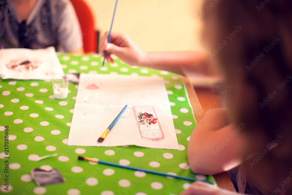 Fototapeta premium Children hands making artworks with wood and paint crafts. workplace and handcraft