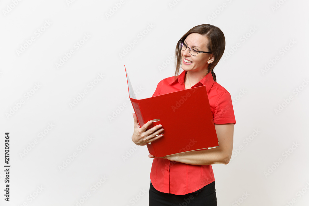 Portrait of young successful business teacher woman in red shirt, glasses holding folder with paper work documents isolated on white background. Education teaching in high school university concept. Portrait of young successful business teacher woman in red shirt, glasses holding folder with paper work documents isolated on white background. Education teaching in high school university concept.