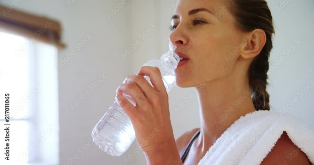 Woman drinking water in the gym 4k Woman drinking water in the gym 4k