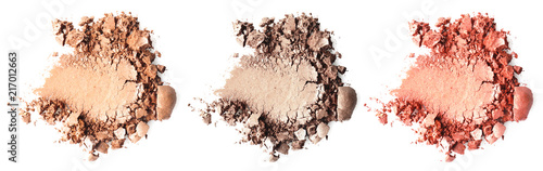 Crushed makeup products on white background. Color set of eye shadows