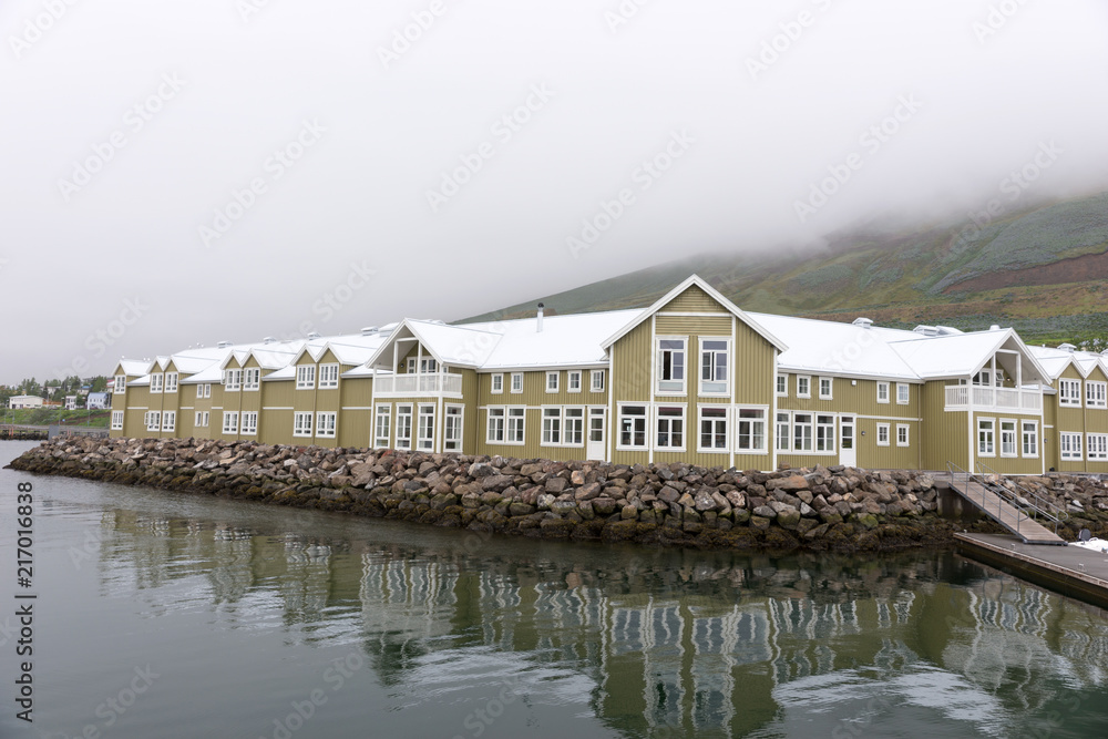 Wooden houses in Siglufjördur, former center of herring fishing in the north of Iceland Wooden houses in Siglufjördur, former center of herring fishing in the north of Iceland