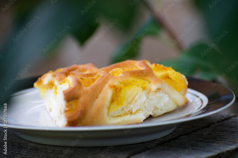 Delicious cake with apricot jam on a plate. Crostata with marmalade or peach jam filling. Homemadepie dessert with dandelion jam. Delicious cake with apricot jam on a plate. Crostata with marmalade or peach jam filling. Homemadepie dessert with dandelion jam.