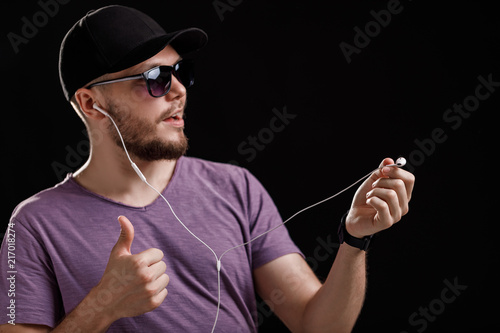 the man listening to music in headphones