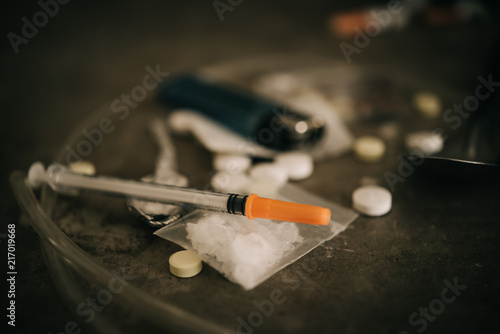 Asian men are drug addicts to inject heroin into their veins themselves.Flakka drug or zombie drug is dangerous life-threatening,Thailand no to drug concept,The bad guy drugs in the desolate photo